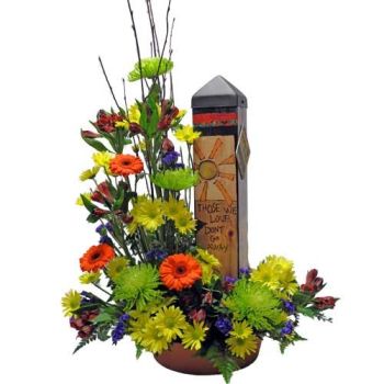 sympathy peace pole with flowers 